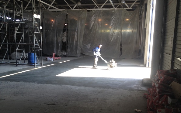 Work in warehouse concrete floor repair on site in Nizhny Novgorod